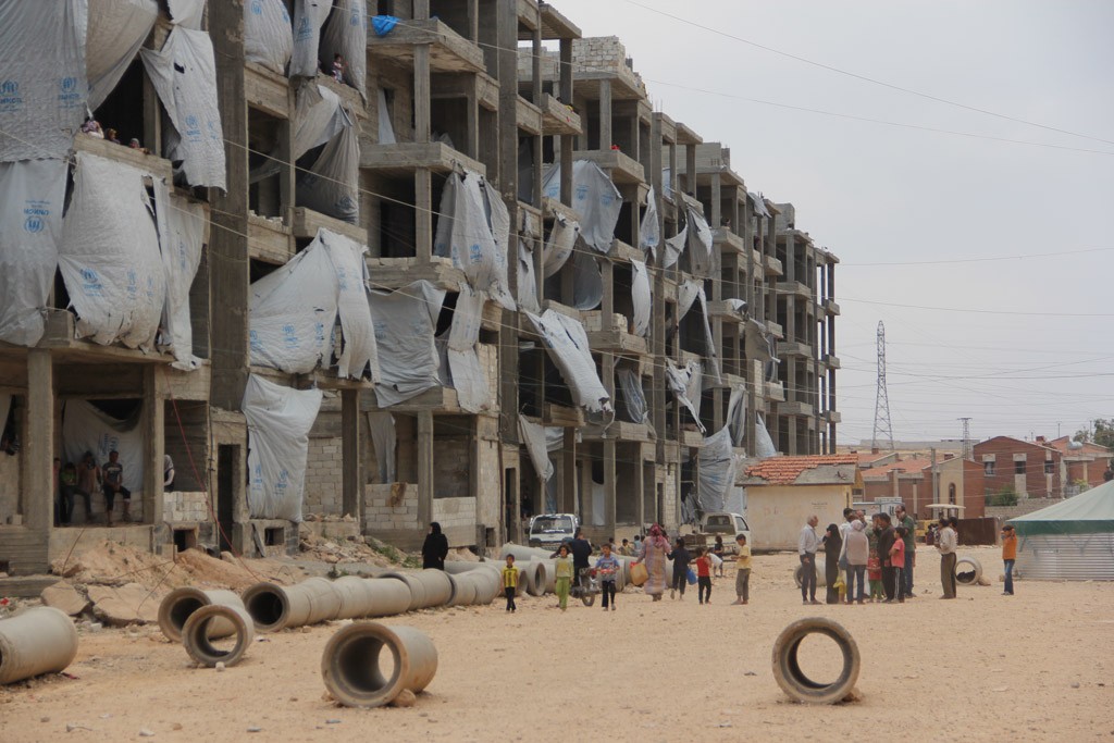 In the Tishreen camp for displaced persons in Aleppo, Syria, residents go about their daily lives. Photo Courtesy UNICEF/Razan Rashidi