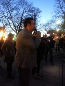 Pakistani American Johny Bashir addressing DuPont Circle Vigil in memory of Pakistani victims Photo: Views and News