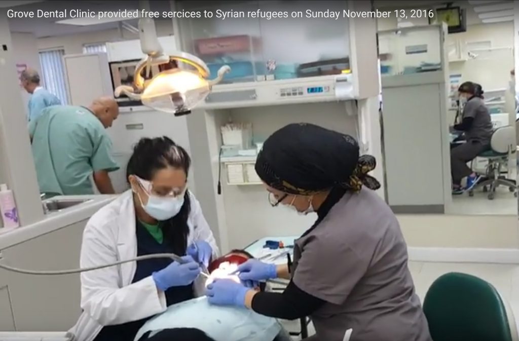 Dentists cleaning teeth of a Syrian child Photo: Views and News