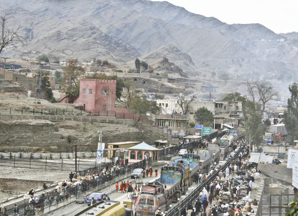 The view into Pakistan from the Afghanistan border at Torkham Gate March 7. As many as 10,000 people cross the border at the gate in a busy day, including between 1,000 and 2,000 trucks. Photo: By Staff Sgt. Ryan Matson (U.S. Armed Forces) [Public domain], via Wikimedia Commons