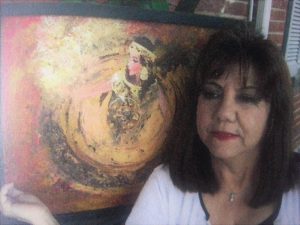 Artist Edith Graciela Sanabria with her work