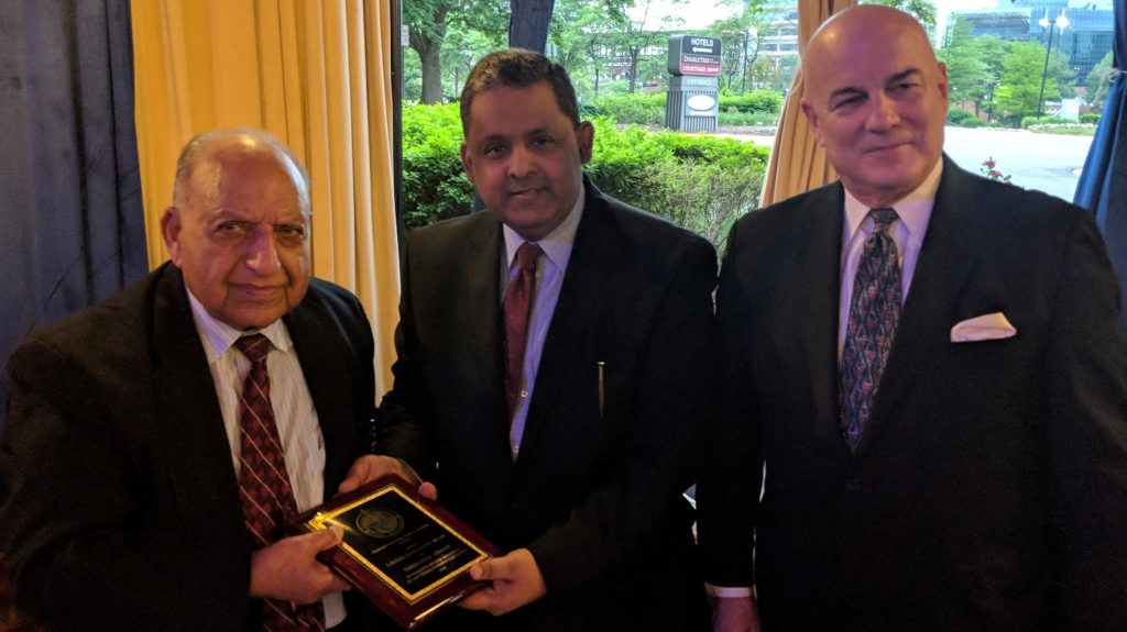 Mr. Tom McDevitt, Chairman The Washington Times, Mr. Rizwan Sheikh, DCM at the Pakistani Embassy give award to journalist Salahuddin Ahmed
